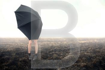 girl with umbrella on black field