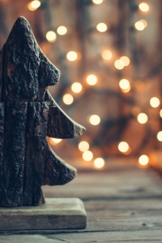 Wooden christmas tree on rustic background