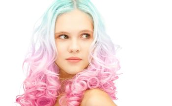 beauty and hairstyle concept - teen girl with trendy blue and pink gradient dyed hair. teen girl with trendy colorful gradient dyed hair