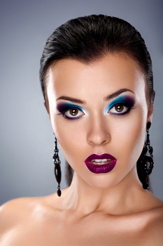 Holiday evening make up. Stylish beauty young woman face
