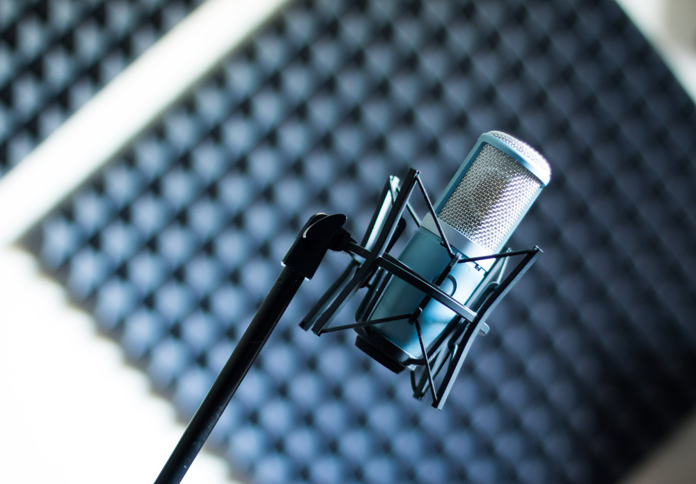 Professional studio microphone in a recording studio, sound insulation in the blurry background
