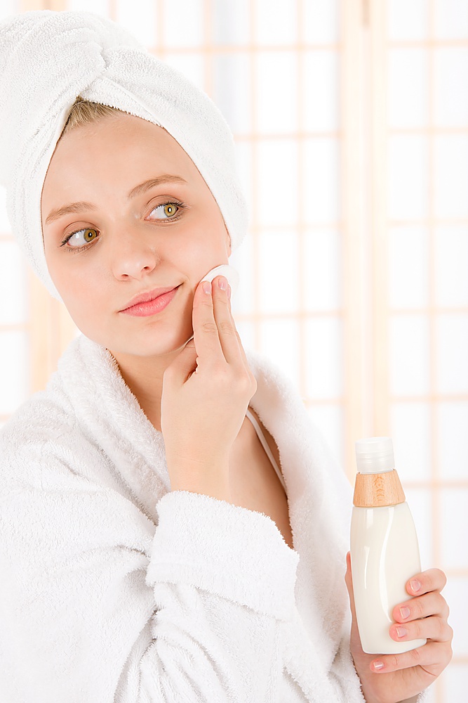Acne facial care teenager woman clean skin in bathroom
