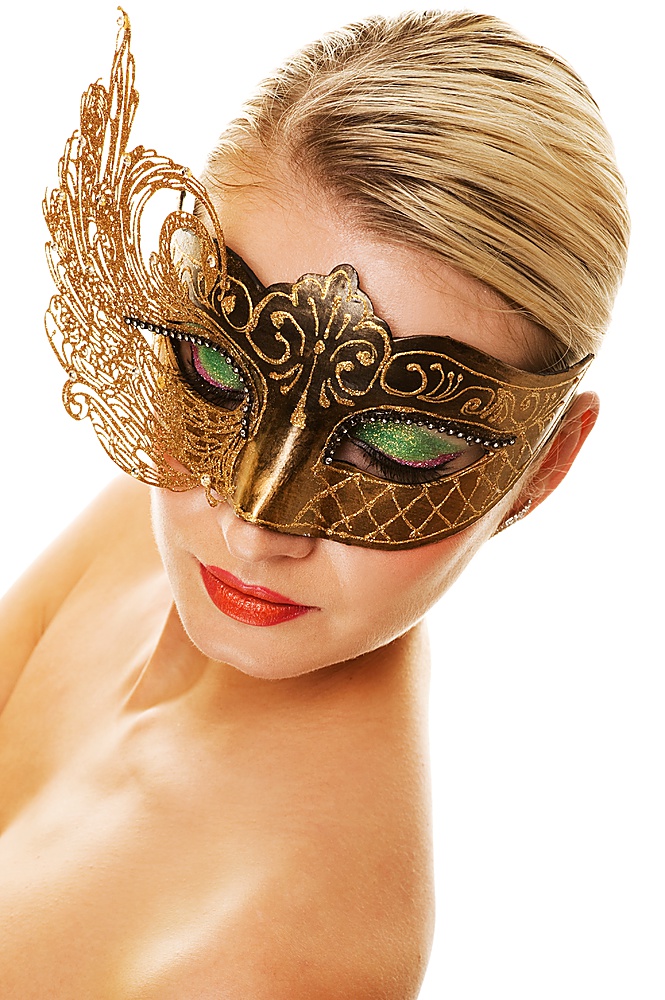 Lovely young woman with carnival mask on her face