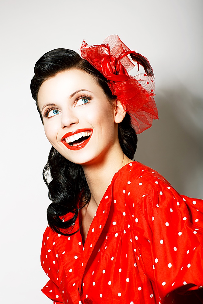 Retro Style. Elation. Portrait of Happy Toothy Smiling Woman in Pin Up Red Dress
