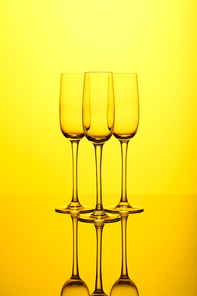 Glasses with wine on the color background