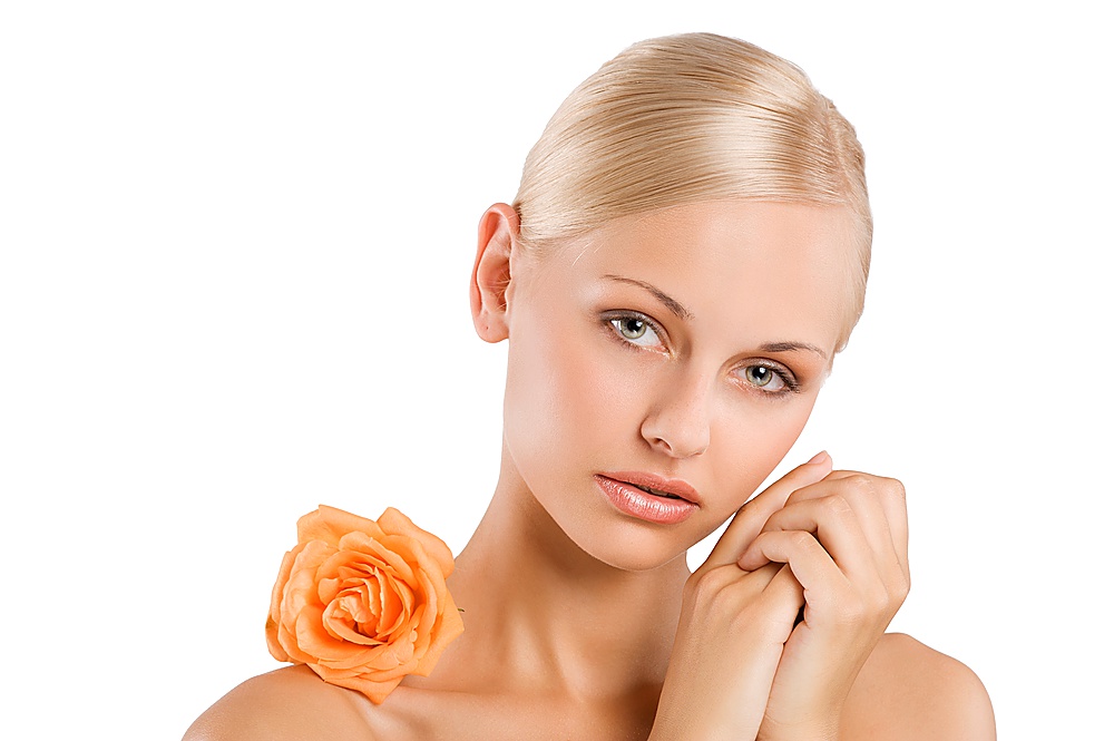 beauty portrait over white af sweet and nice blond girl with an orange rose on her shoulder