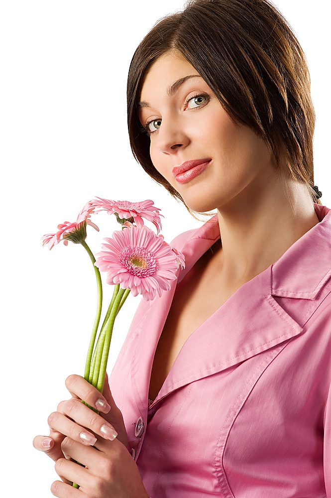 nice shot of a cute young woman with pink jacket and pink flowers making face