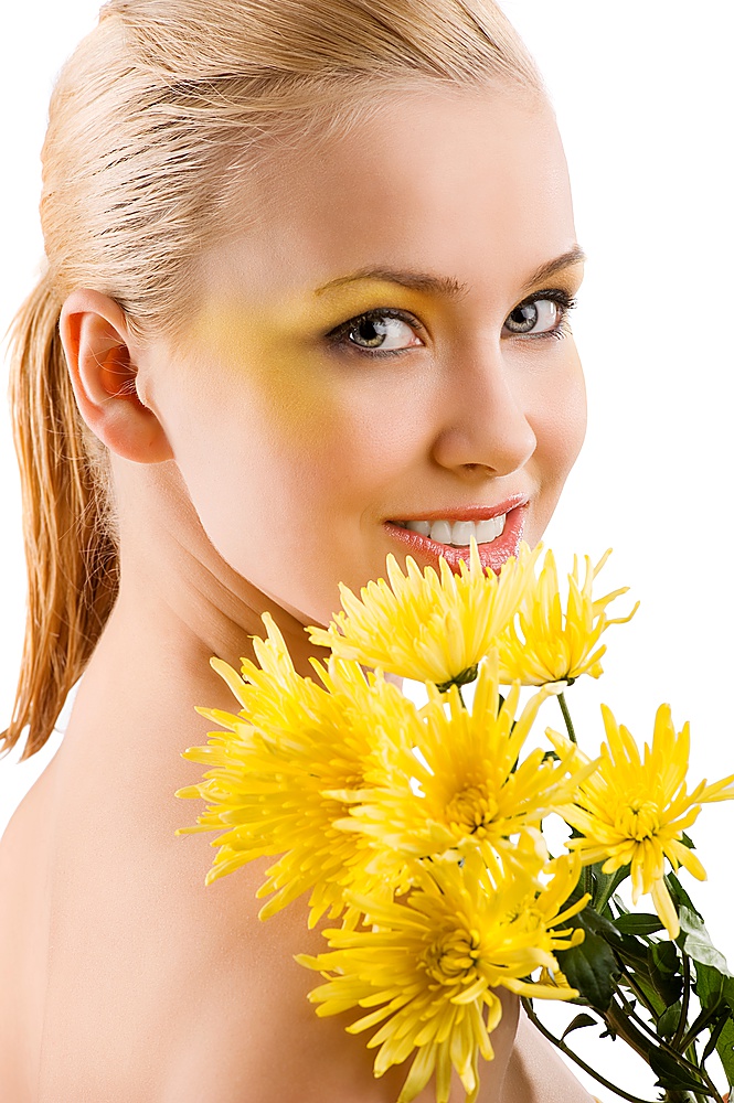 beauty portrait of young cute blond girl with colored make up and some yellow flowers