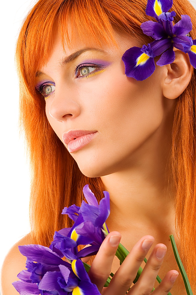 Close-up portrait of a fresh and beautiful young model with flower
