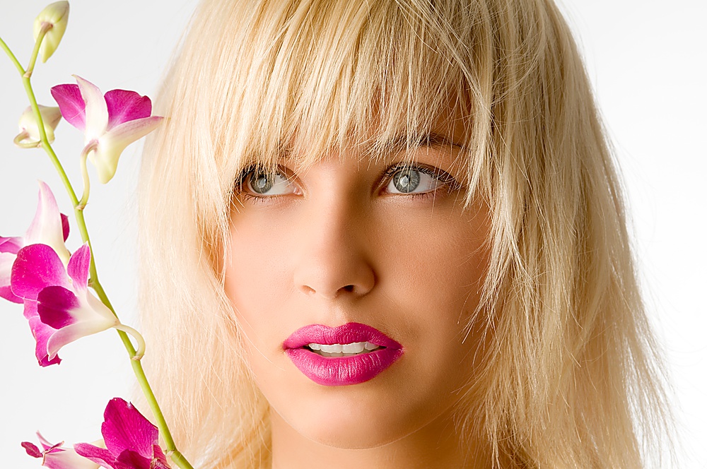 classic beauty style portrait of blond girl with flowers