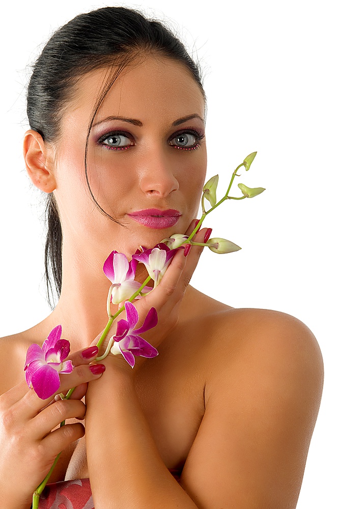 beautiful young brunette with wonderful fair eyes and pink flowers and makeup