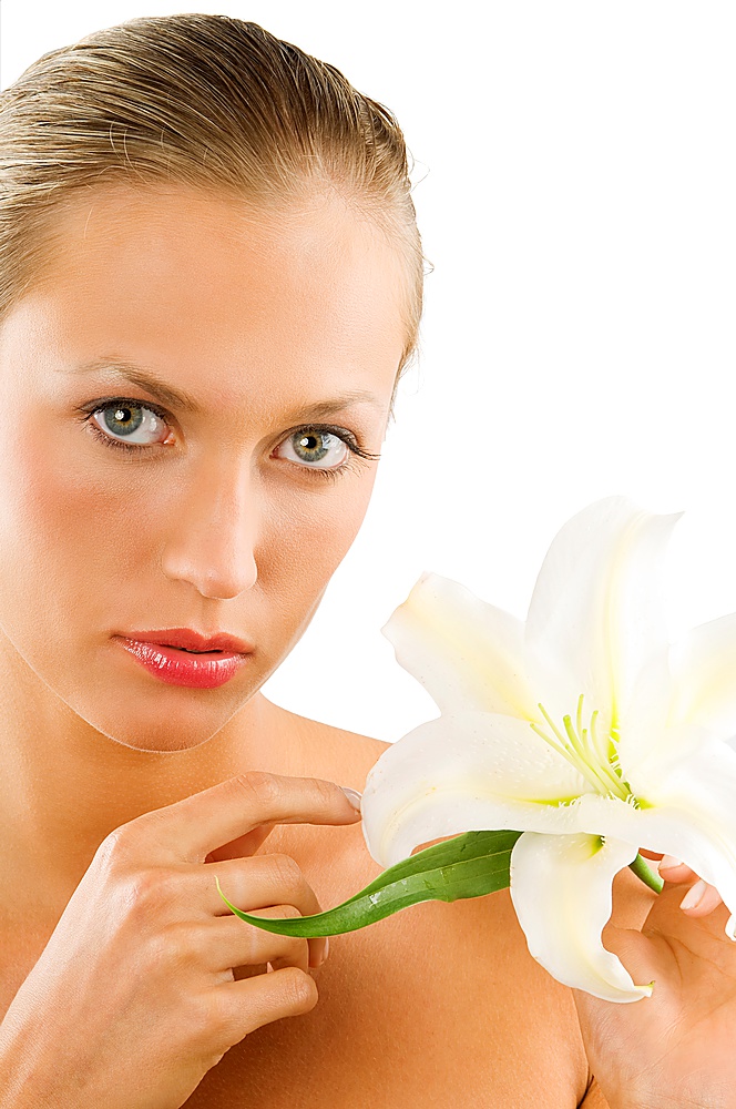 beautiful portrait of a young blond woman with wet hair and a white lily