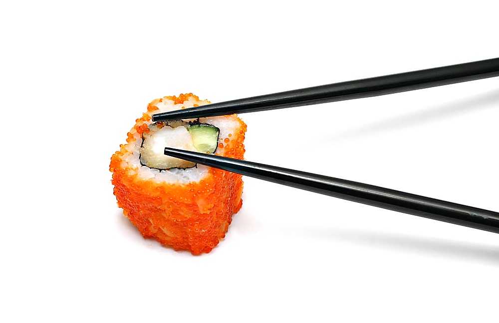 Single japan sushi roll and chopsticks isolated