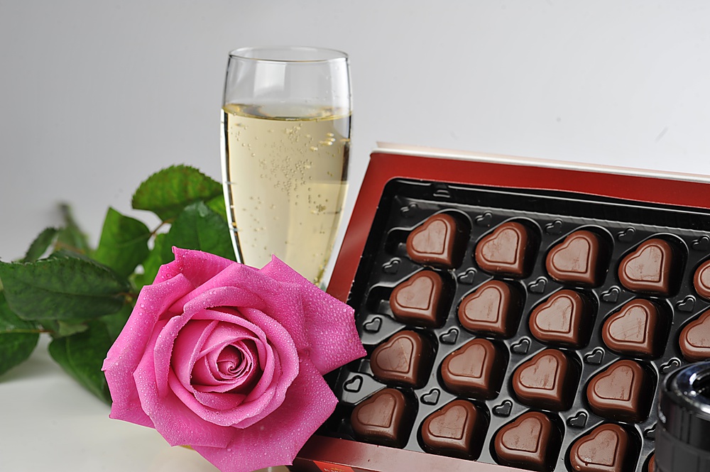 Heart shape chocolate, champagne  and pink rose