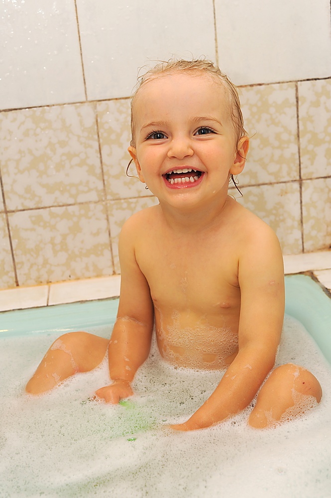 small pretty girl taking bath