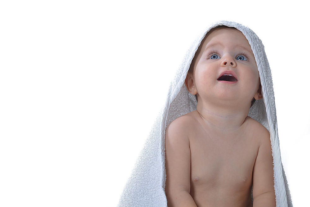Cute baby girl with white towel isolated