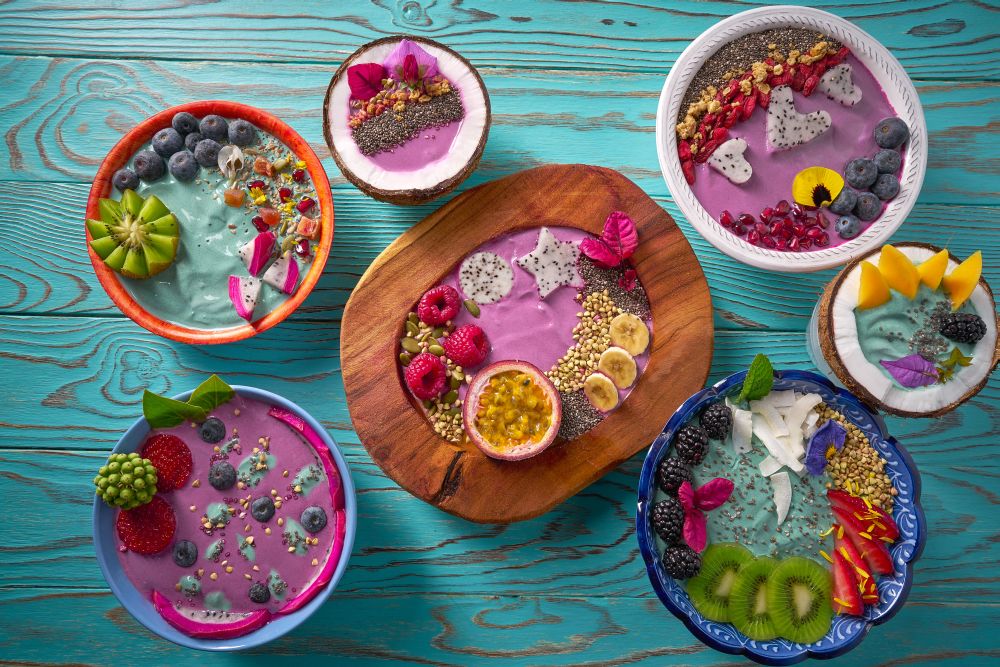 Acai bowl smoothie and Spirulina algae with chia berries and fruits healthy food