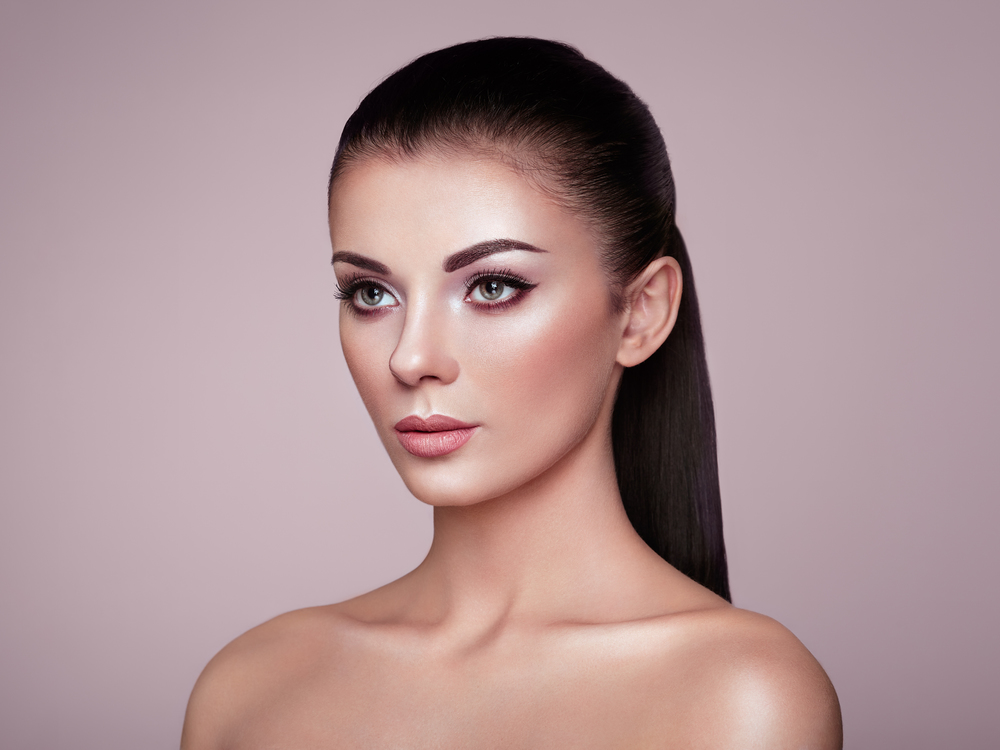 Beautiful woman face. Beautiful Young Woman with Clean Fresh Skin. Perfect Makeup. Beauty Fashion. Eyelashes. Cosmetic Eyeshadow. Highlighting. Cosmetology, Beauty and Spa
