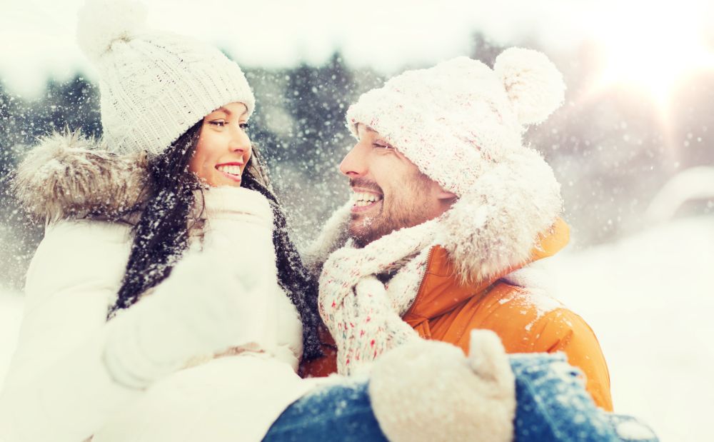 people, season, love and leisure concept - happy couple outdoors in winter. happy couple outdoors in winter