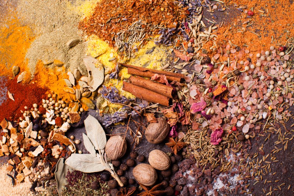 Flat lay composition of various spices as art color abstract painting, top view. Flat lay spicy frame