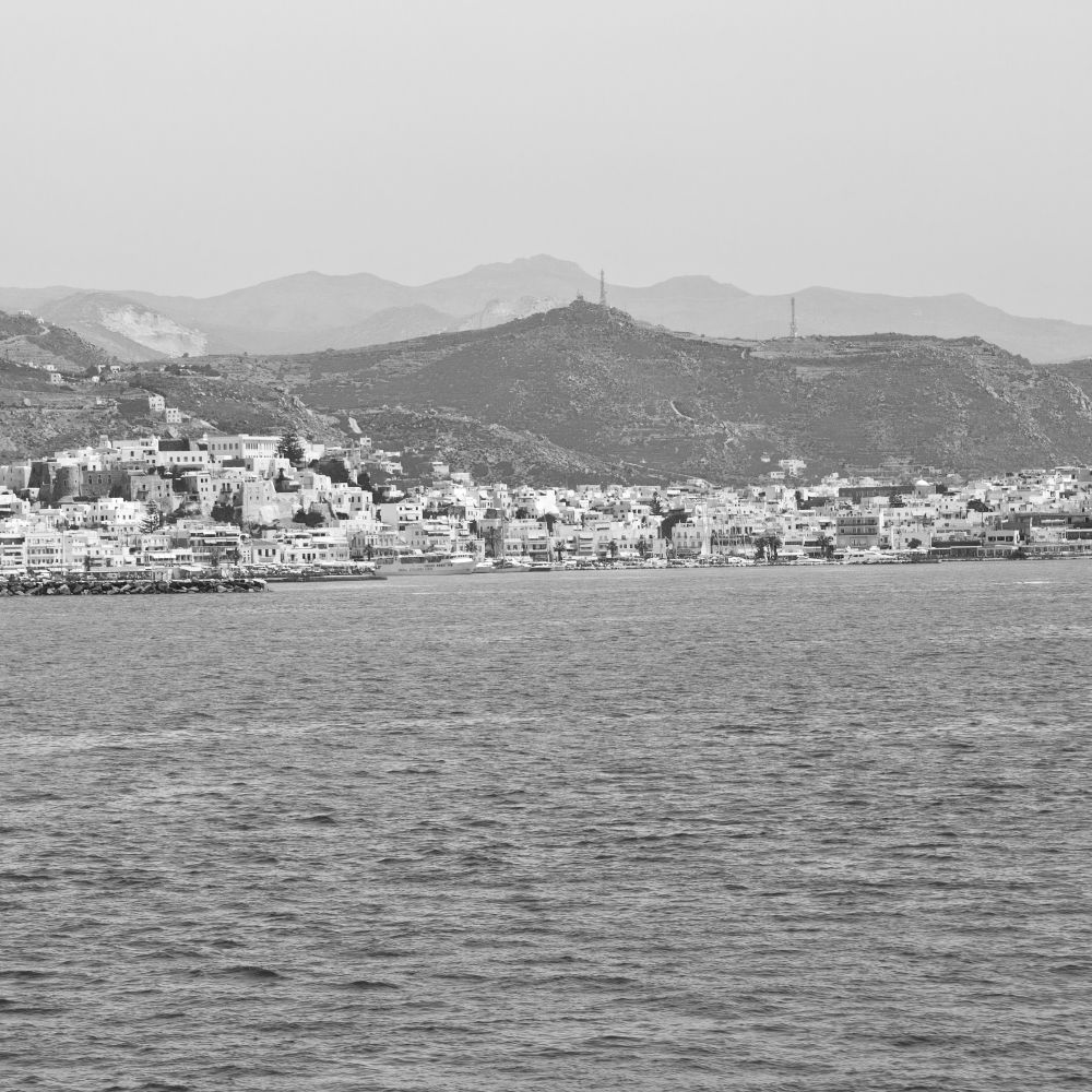 sailing in europe greece santorini island hill  and rocks on the summertime beach