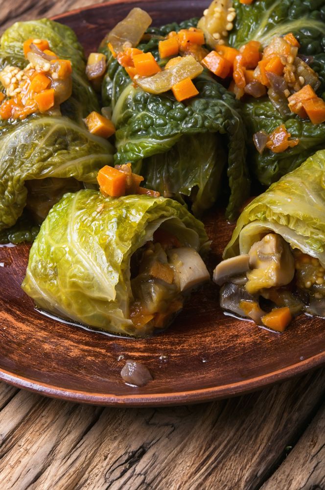 cabbage rolls with vegetable. Ukrainian vegetable dietary cabbage rolls in leaf of savoy cabbage