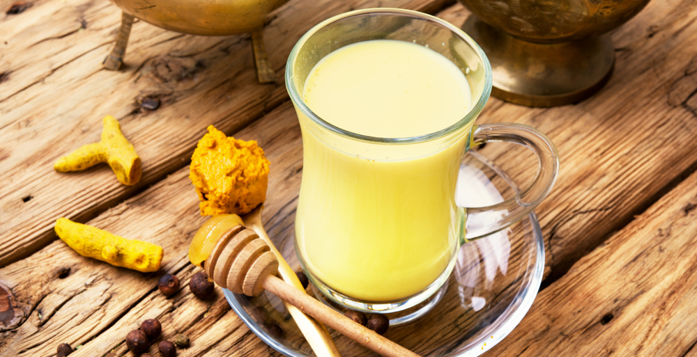 Turmeric Golden milk. Cup of golden milk made with turmeric