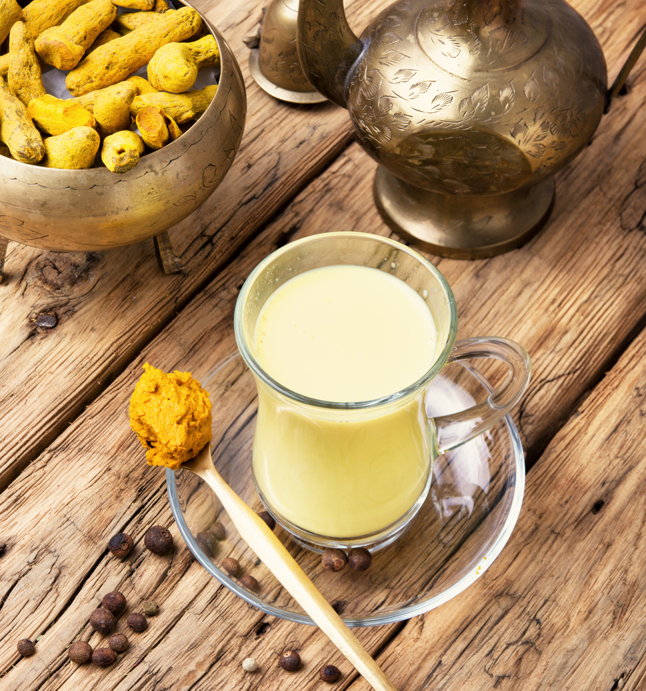 Turmeric Golden milk. Turmeric Golden milk in a glass cup