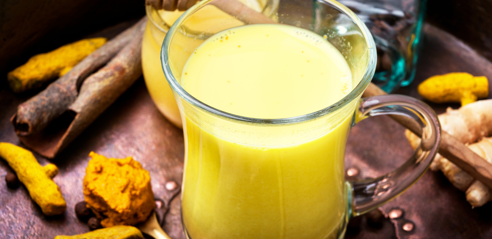 Turmeric Golden milk. Turmeric Golden milk in a glass cup