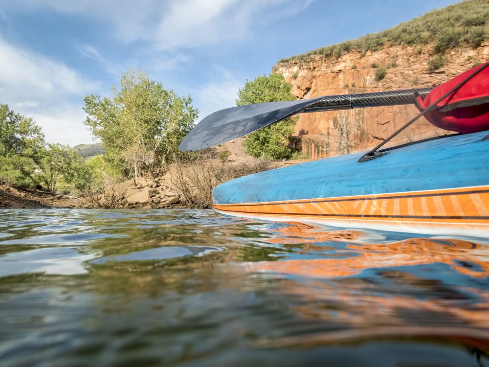 Stand up paddleboard with a carbon fiber paddle - low angle view on Horsetooth Reservoir in northern Colorado