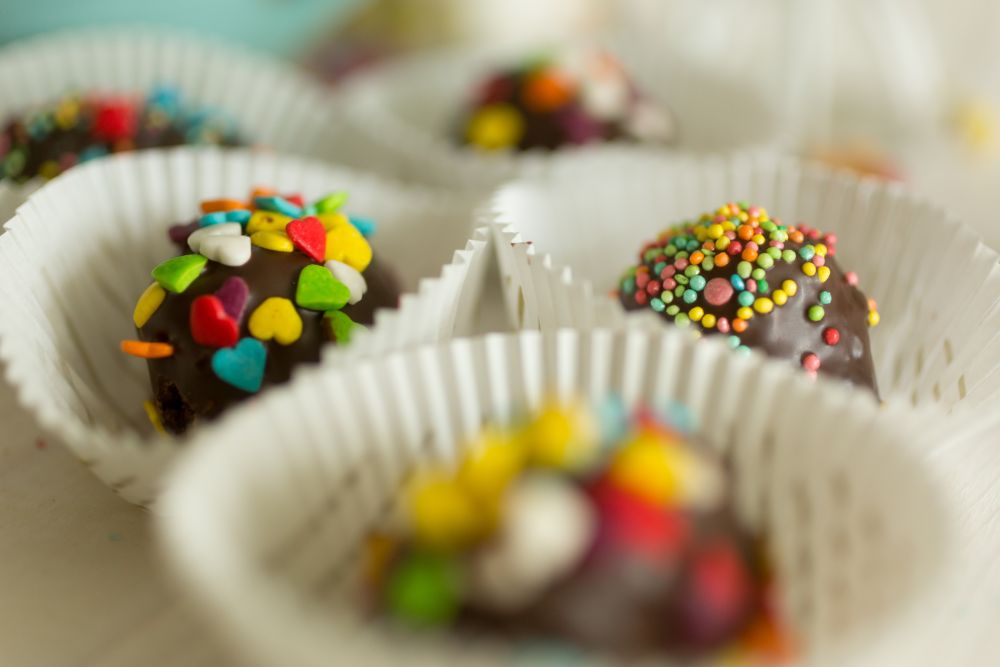 Chocolate candies with colorful sprinkles on top