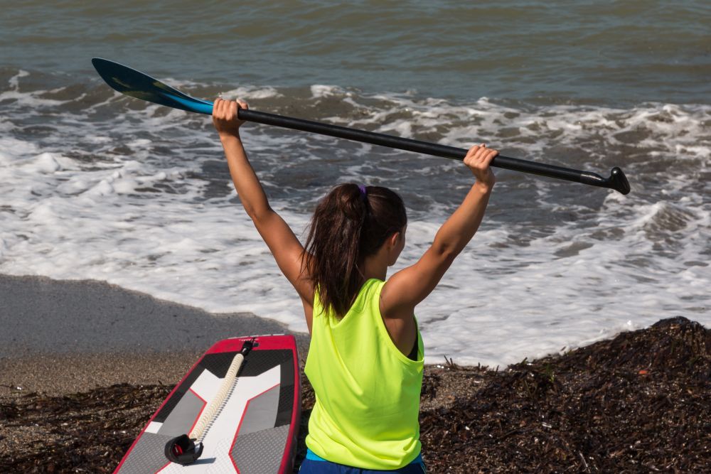 Girl Stretching Her Arm&rsquo;s Muscles with Oar before Surfing, Stand Up Paddle
