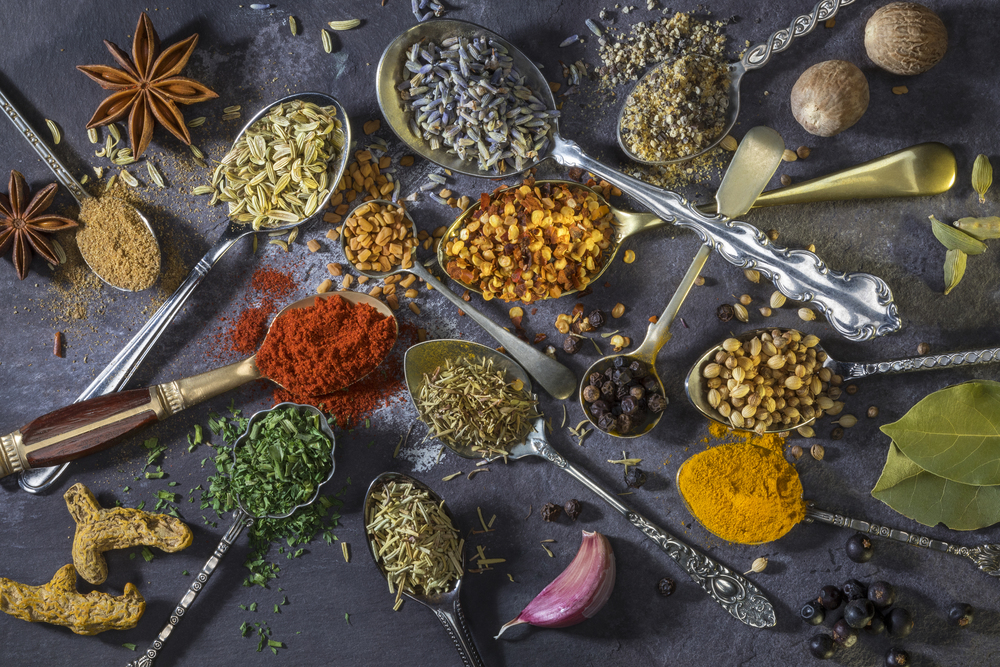 Spices on spoons - a selection of spices used to add flavor to cooking.