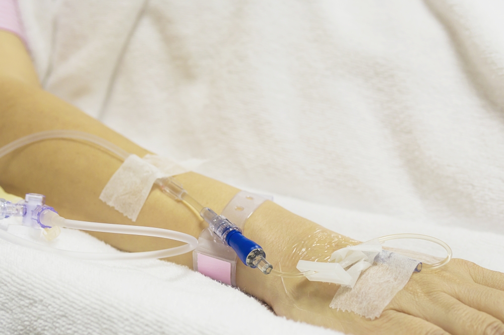 A patient is receiving medication via intravenous therapy