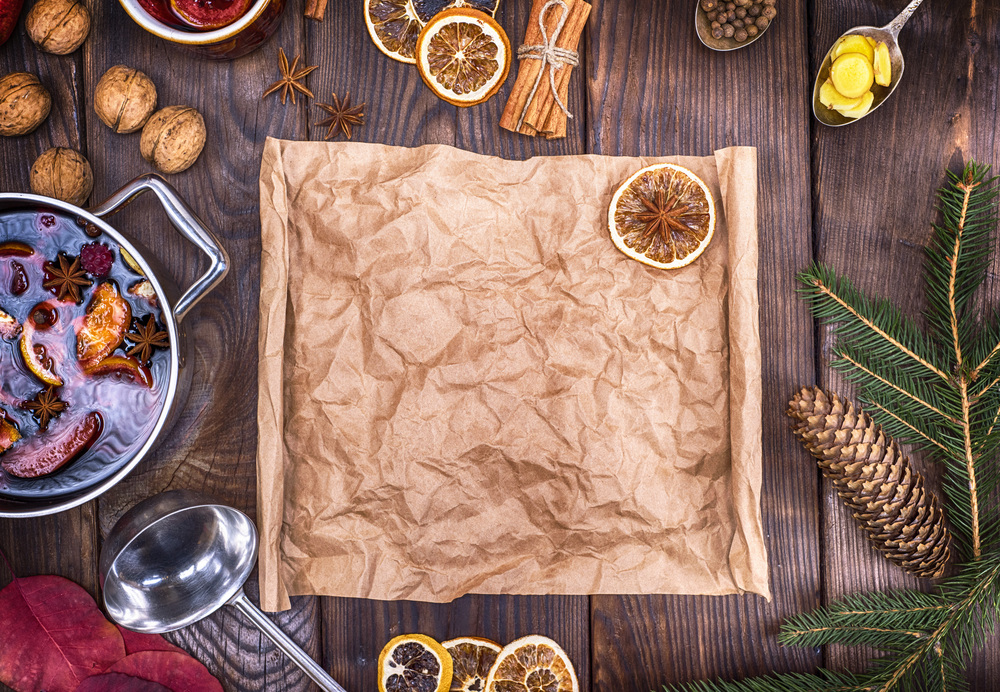 brown paper and ingredients for making mulled wine, top view