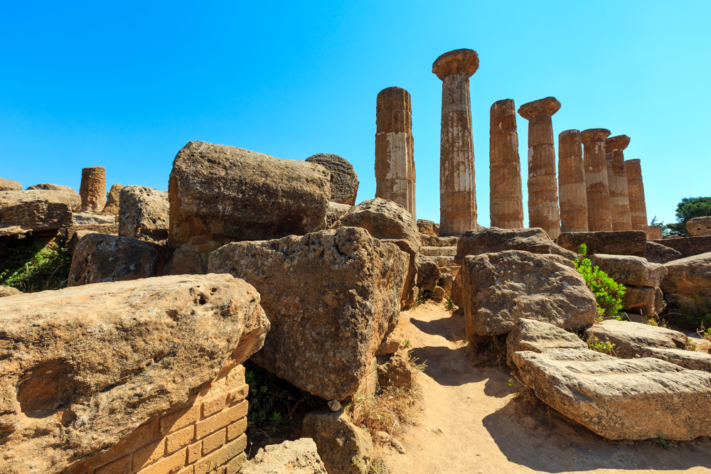 Ruined Temple of Heracles columns in famous ancient Valley of Temples, Agrigento, Sicily, Italy. UNESCO World Heritage Site.