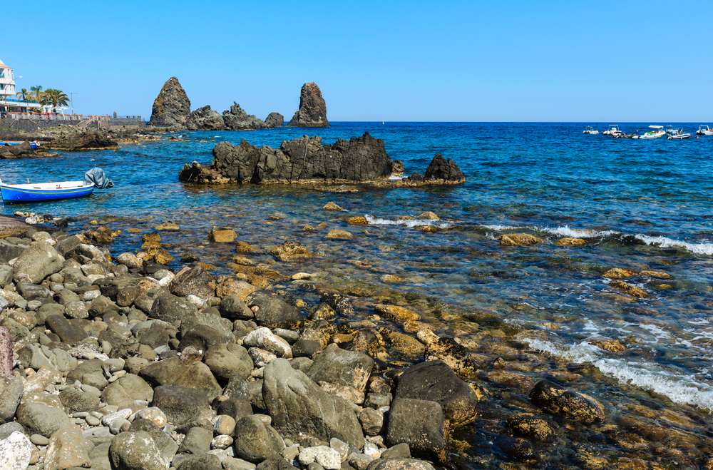 Cyclopean Coast and the Islands of the Cyclops on Aci Trezza town (Italy, Sicily,10 km north of Catania). Known as Isoles Dei Ciclopi Faraglioni.