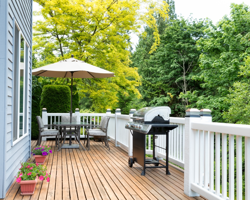 Clean outdoor cedar wooden deck and patio of home during daytime