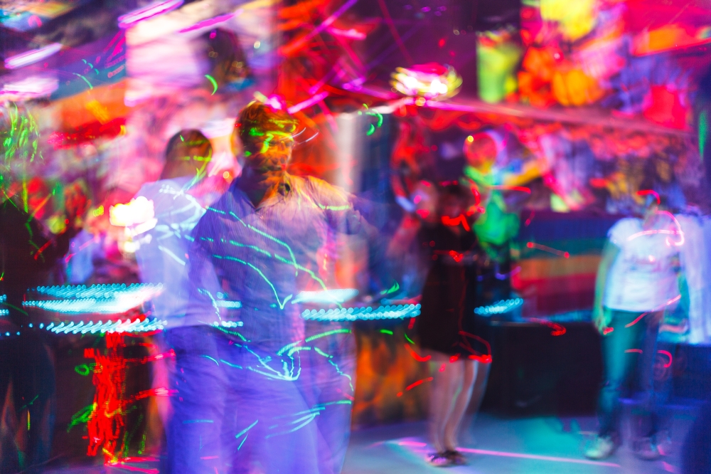 People having fun in a disco. blur effect for an artistic touch. The people having fun in a disco. blur effect for an artistic touch