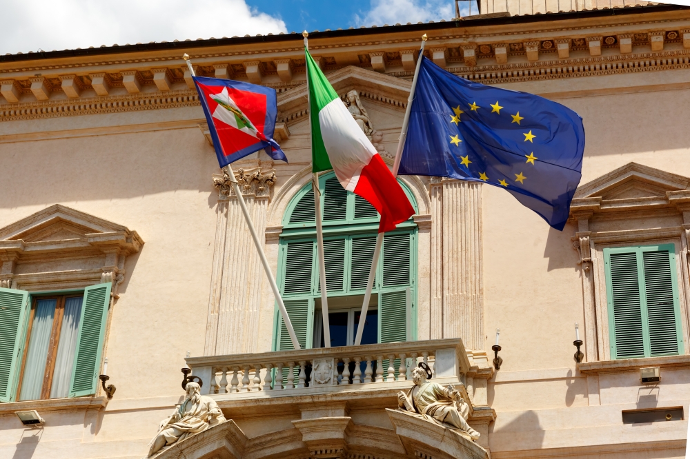Italian and European flags, Rome, Italy. Beautiful large waving Flag of the European Union, Flag of Italy and Italian Presidential pennant on the balcony of the Quirinal Palace, Rome, Italy.