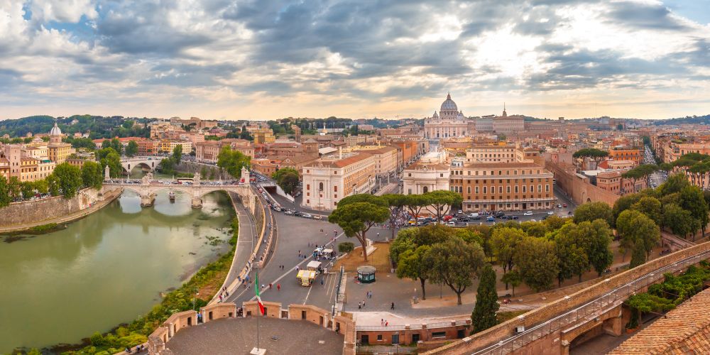 Aerial wonderful view of Rome at sunset, Italy. Panoramic aerial wonderful view of Rome with river Tiber and Saint Peter Cathedral at sunset time in Rome, Italy