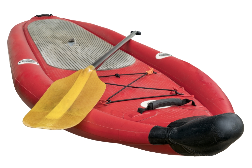 whitewater inflatable stand up paddleboard with a kayak paddle isolated on white with a clipping path