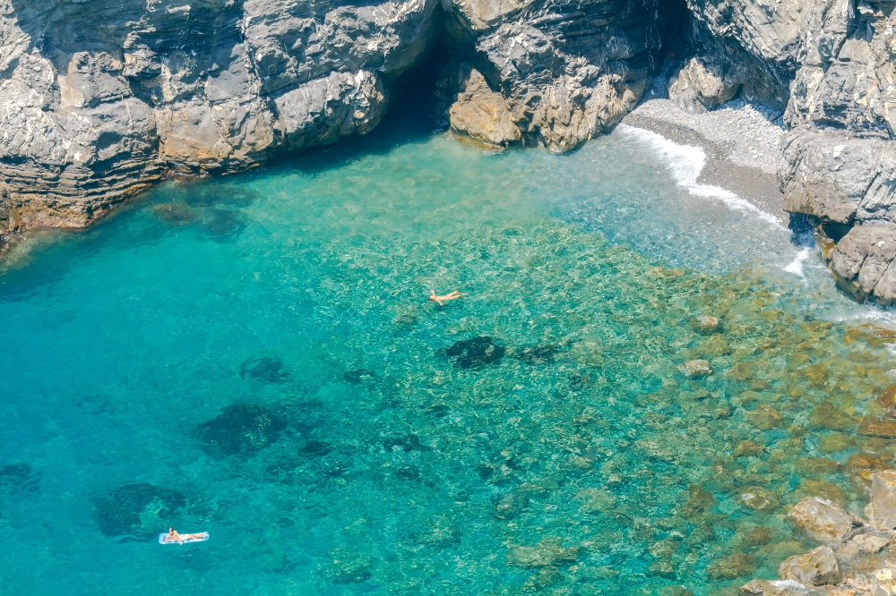 Corniglia. Public Beach.. Small pebble beach with crystal clear water near the village of Corniglia. Cinque Terre. Liguria.