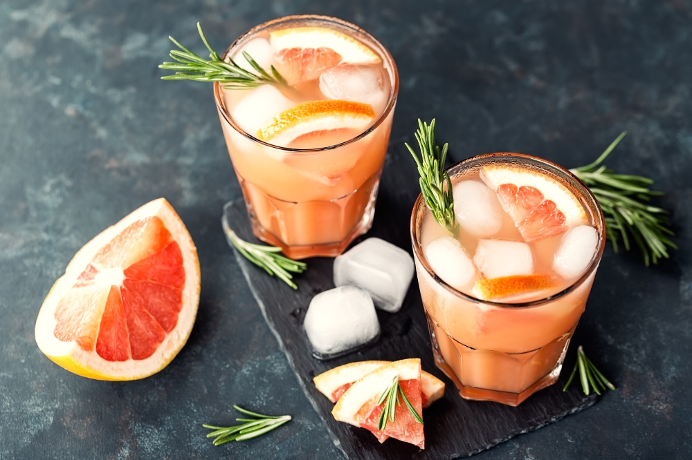 Grapefruit and rosemary gin cocktail or margarita, refreshing drink with ice