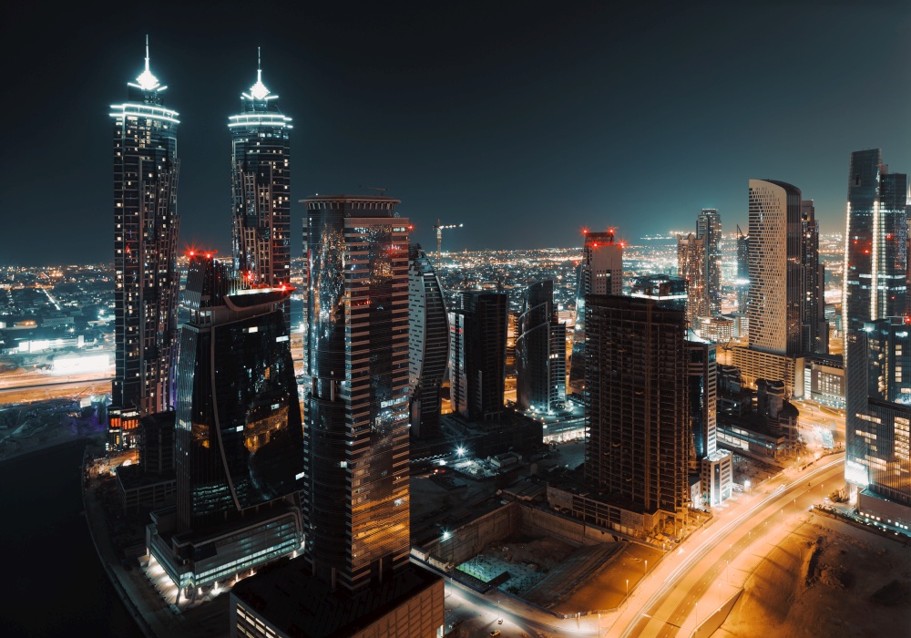 Beautiful Cityscape of a Modern Futuristic Buildings and Towers in the Lights of a Night City. Beauty of Luxury Life of Emirates. Dubai. United Arab Emirates.