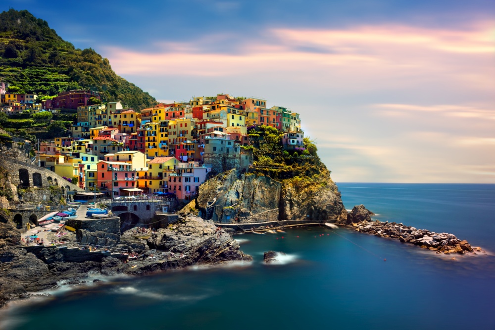 Beautiful landscape of a coastal fishing village, amazing view on many little colorful houses, traditional architecture of the little Italian town called Cinque Terre