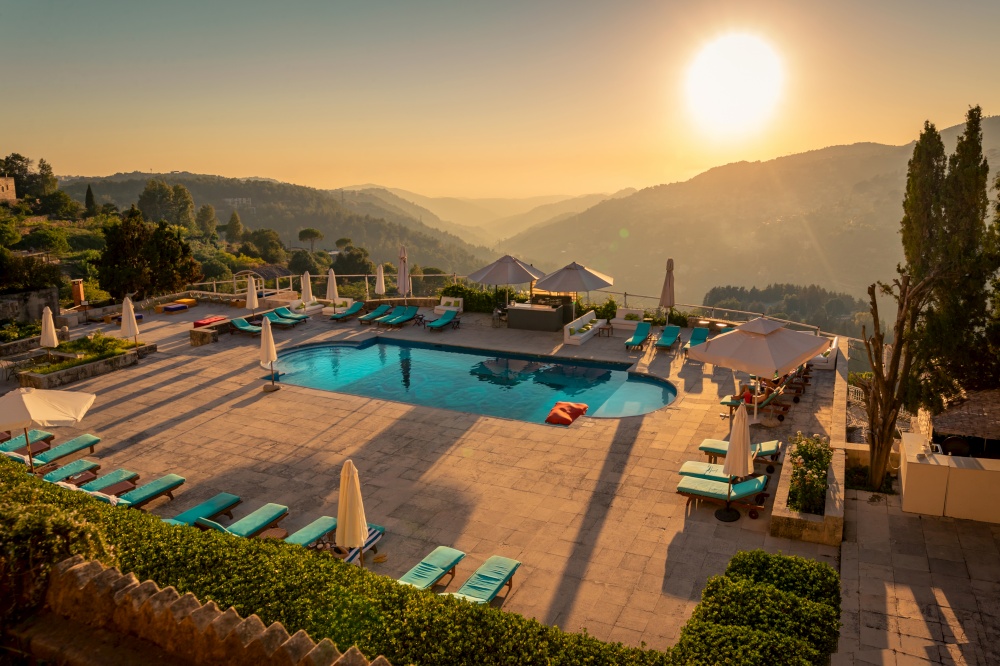 Traveling Lebanon. Pool with Refreshing Water in the Mild Sunset Light. Beautiful Resort in the Heart of the Mountains.