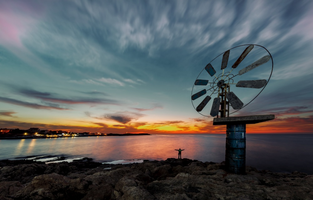 Beautiful View on a Great Windmill over Sunset Sky Background on the Sea Coast. Anfeh. Lebanon