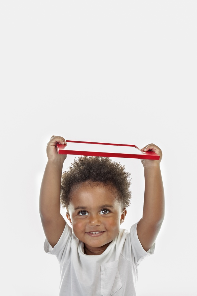 Portrait of a Cute Little African American Boy with Red Frame in Hands. Isolated on White Background. Preschool Education. Back to School Concept.
