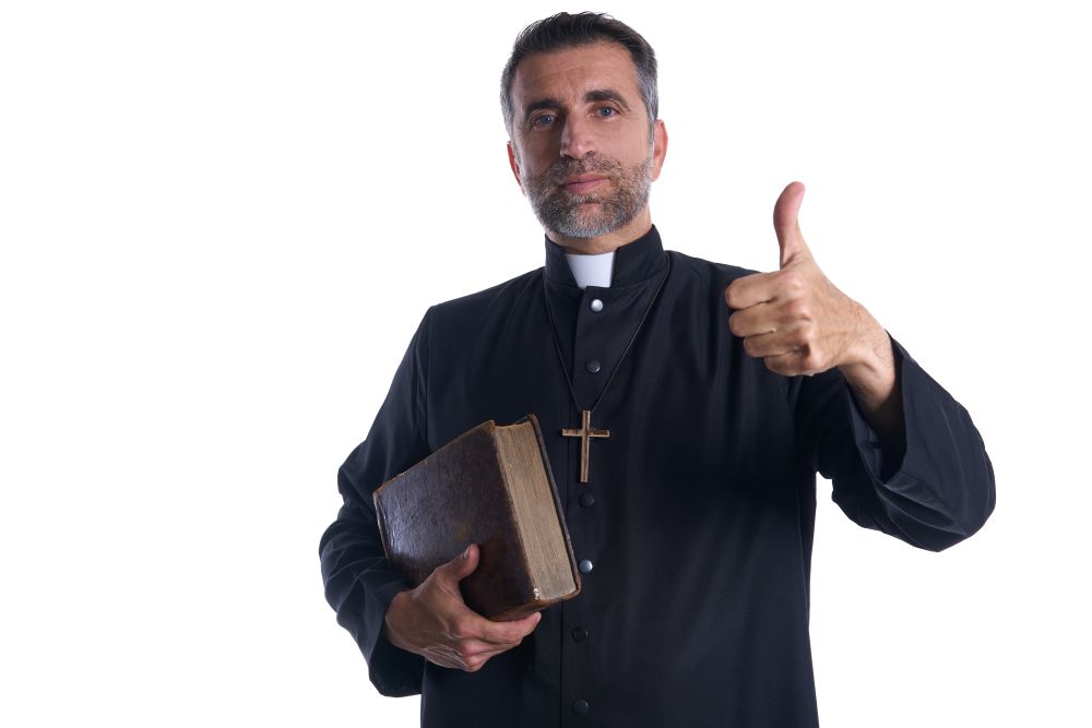 Priest with thumbs up finger hands sign isolated background